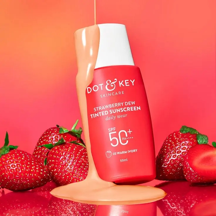 online beauty products of strawberry dew tinted sunscreen spf 50 pa++ in red bottle.background shows strawberries.